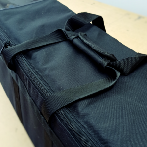 Black tripod bag showing handles and heavy duty zip.
