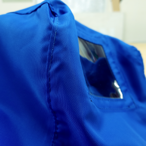Blue fabric cover showing a clear window for a camera cue light.