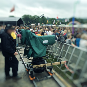 Green Camera cover on a camera at an outdoor event.