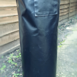 A black pvc gas bottle cover
