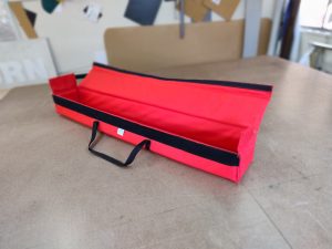 Long red padded equipment bag
